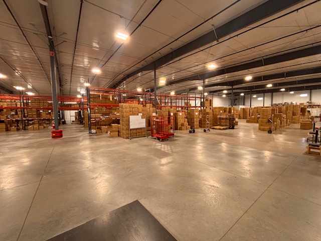 Warehouse with piles and shelves of boxes